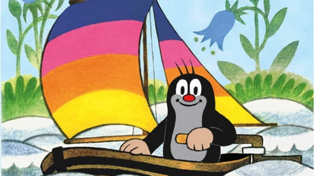 A cartoon image of Krteček the little mole, operating a sail boat